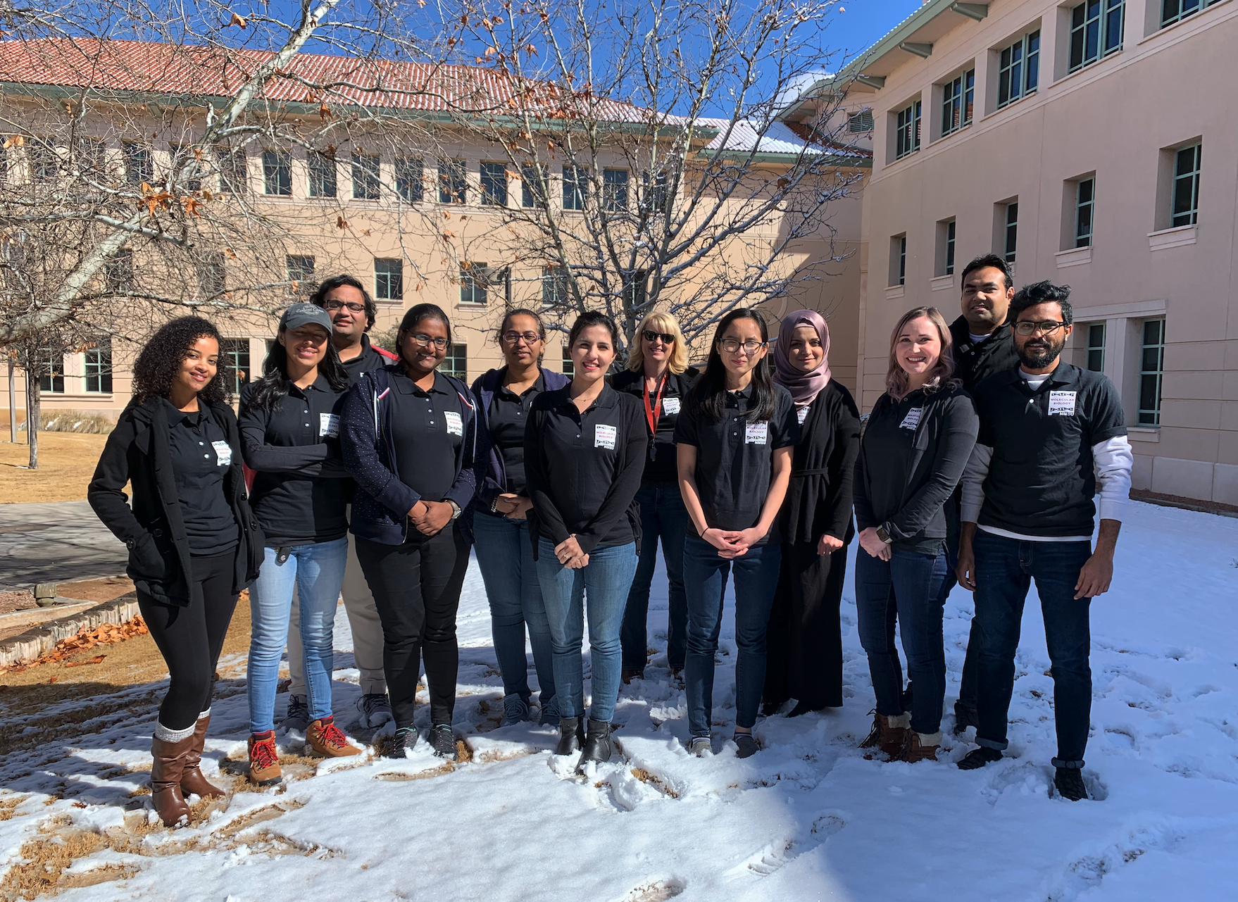 Students on snowy day in front of window